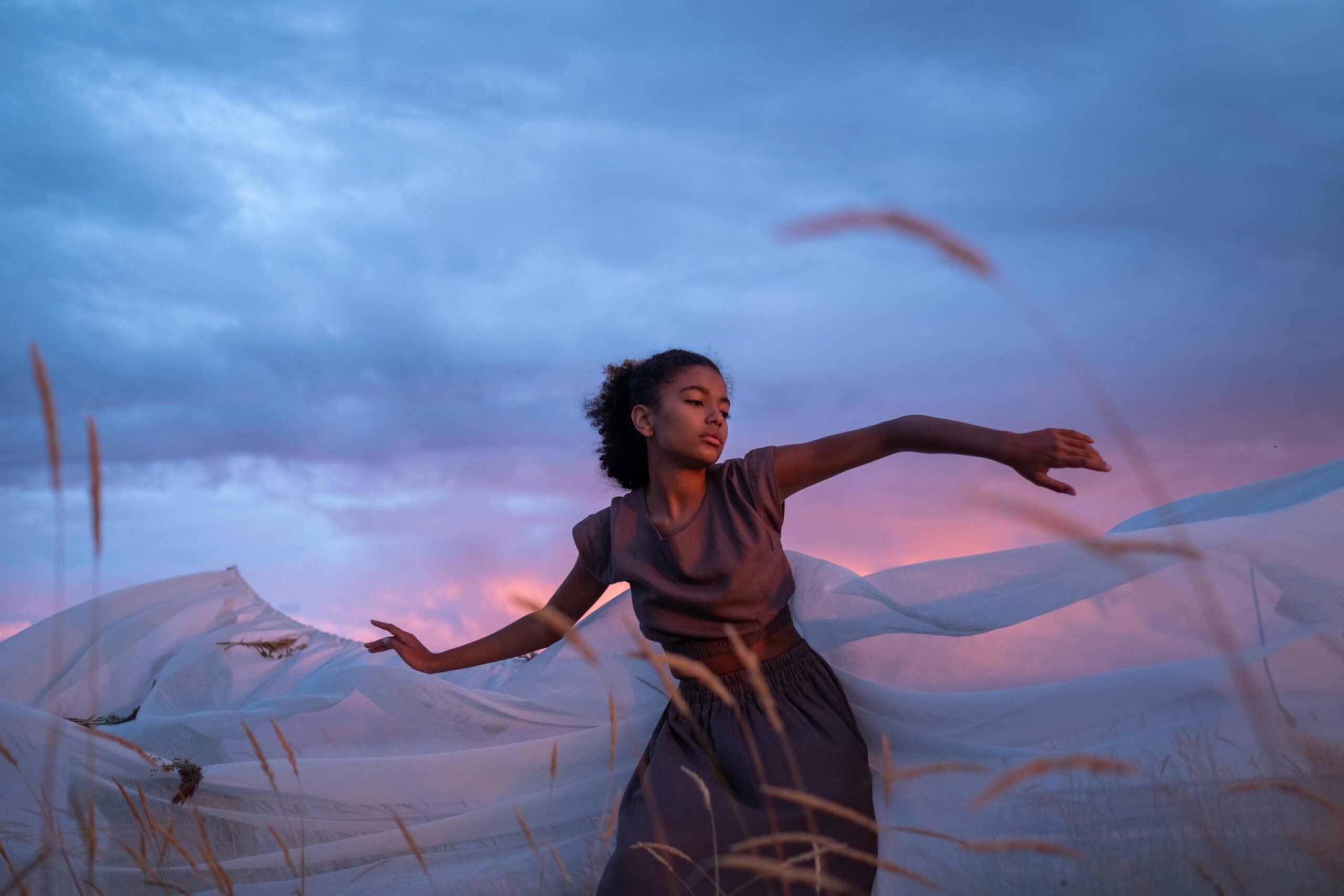 Woman dancing to raise vibration and boost energy