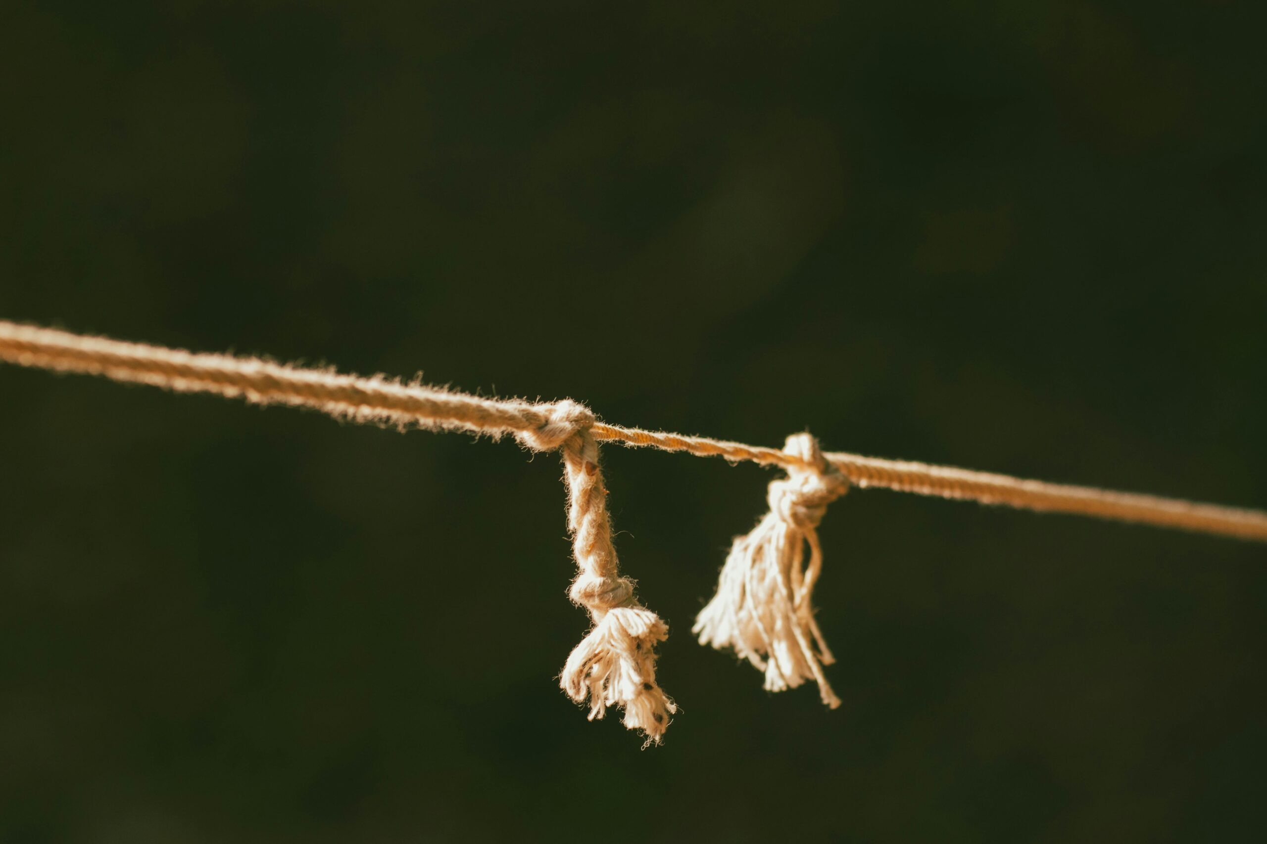 Rope being pulled tight symbolizing the tension of energetic cords that need to be cut with someone.